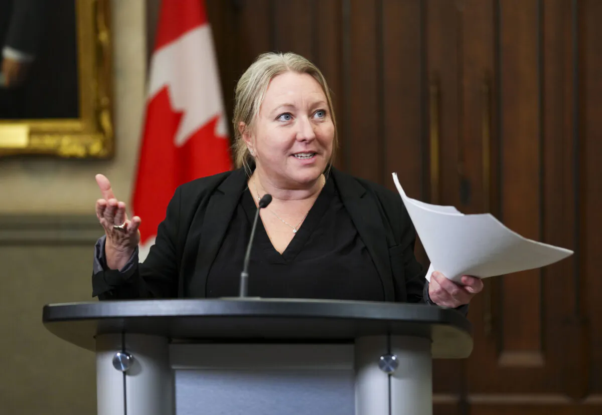 President of the Treasury Board Mona Fortier speaks in the foyer of the House of Commons on Parliament Hill in Ottawa, on Dec. 15, 2022. (Sean Kilpatrick/The Canadian Press)