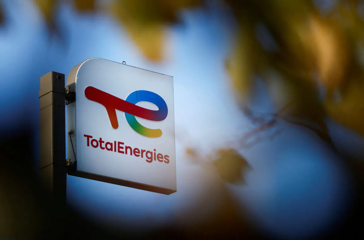A sign with the logo of French oil and gas company TotalEnergies at a petrol station in Bouguenais near Nantes, France, on Nov. 14, 2022. (Stephane Mahe/Reuters)