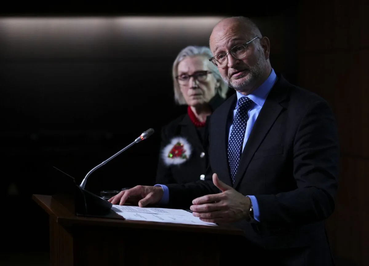 Minister of Justice and Attorney General of Canada David Lametti and Carolyn Bennett, Minister of Mental Health and Addictions and Associate Minister of Health, hold a press conference on Parliament Hill in Ottawa, Dec. 15, 2022. (The Canadian Press/Sean Kilpatrick)
