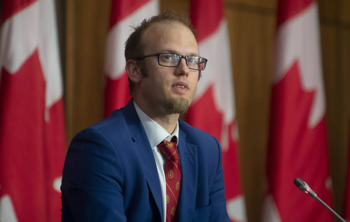 Conservative MP Arnold Viersen listens to a speaker during a news conference in Ottawa on May 27, 2021. (The Canadian Press/Adrian Wyld)