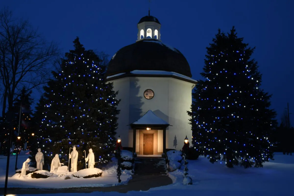 An illuminated Nativity scene in front of Bronner’s Silent Night Memorial Chapel. "Silent Night" plays from outdoor speakers. (Bronner's CHRISTmas Wonderland)