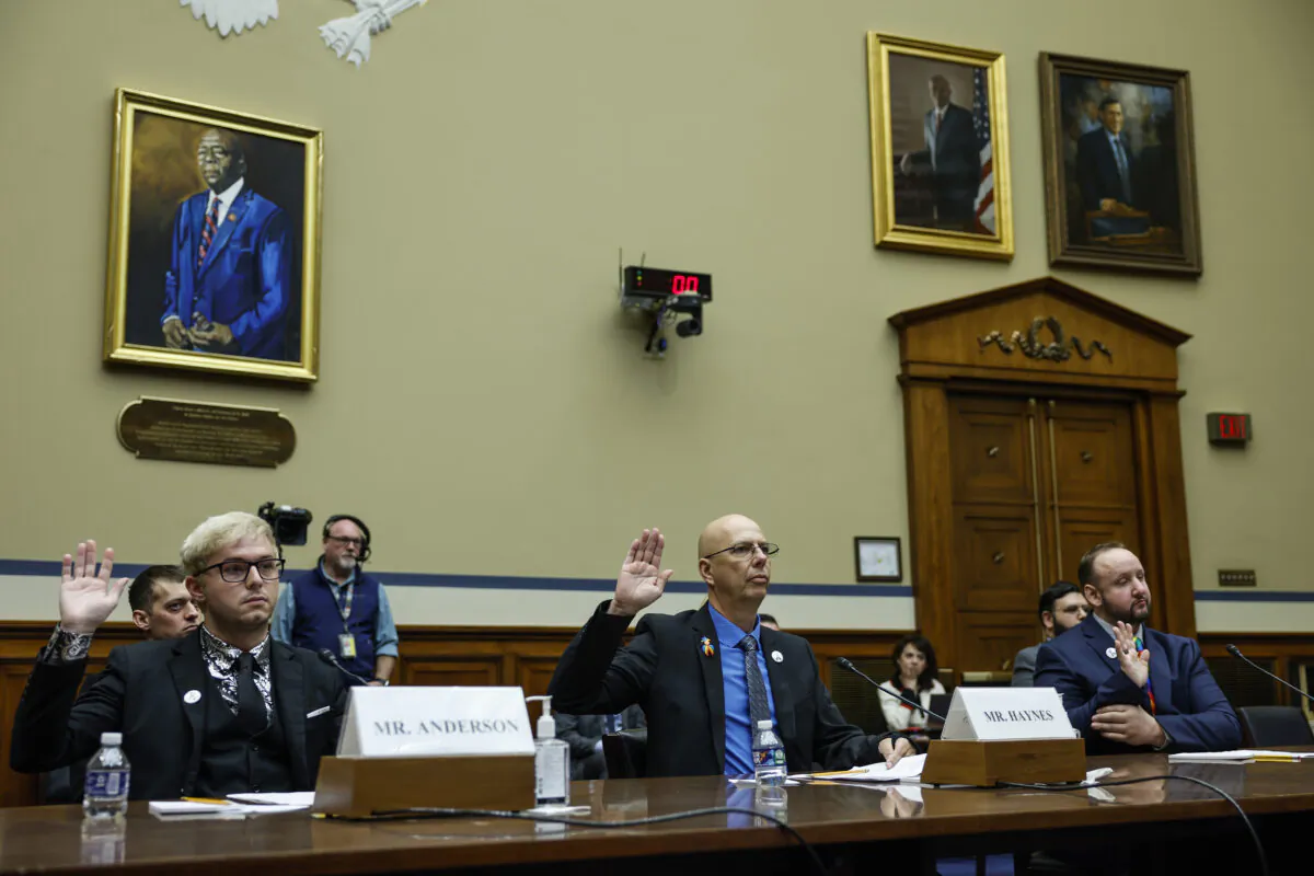 Michael Anderson (L), a survivor of the Club Q shooting in Colorado Springs, Matthew Haynes (C), the owner of Club Q, and James Slaugh (R), another survivor, sworn at the House Oversight Committee hearing in Washington on Dec. 14, 2022. (Anna Moneymaker/Getty Images)