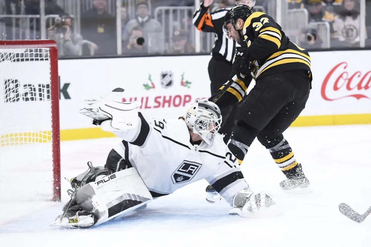 Los Angeles Kings goaltender Pheonix Copley (29) makes a pad save on Boston Bruins center Patrice Bergeron (37) during the first period at TD Garden in Boston, on Dec. 15, 2022. (Bob DeChiara/USA TODAY Sports via Field Level Sports)