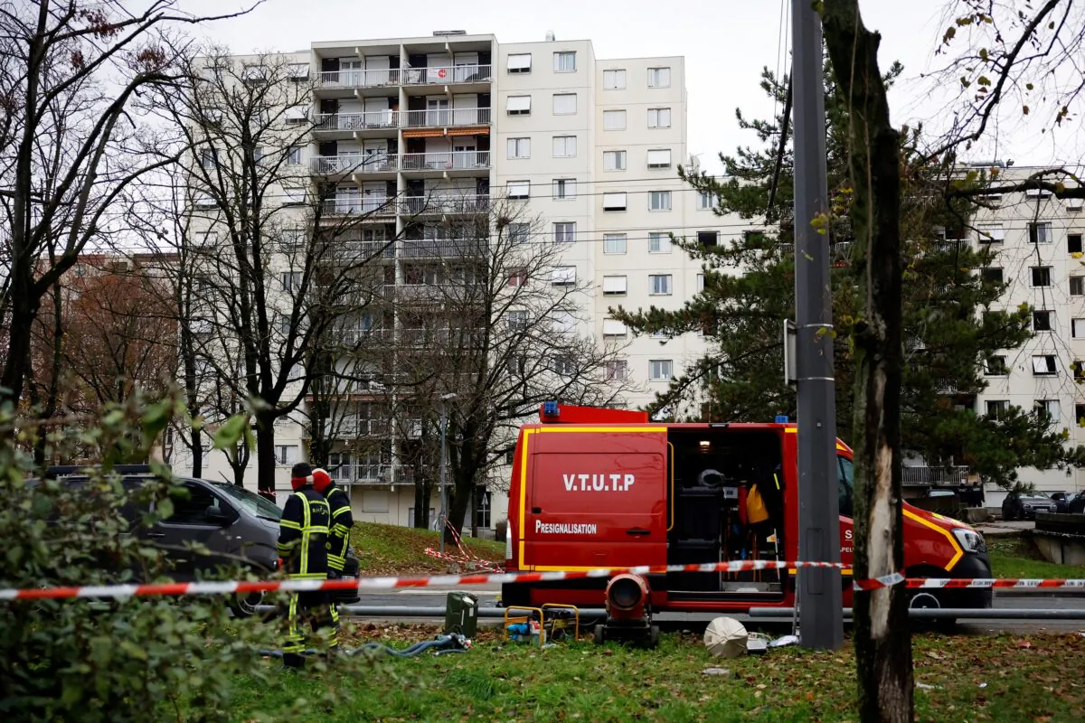 French firefighters work at the scene of a massive building fire where 10 people died and 14 injured in Vaulx-en-Velin, near Lyon, France, on Dec. 16, 2022. (Sarah Meyssonnier/Reuters)