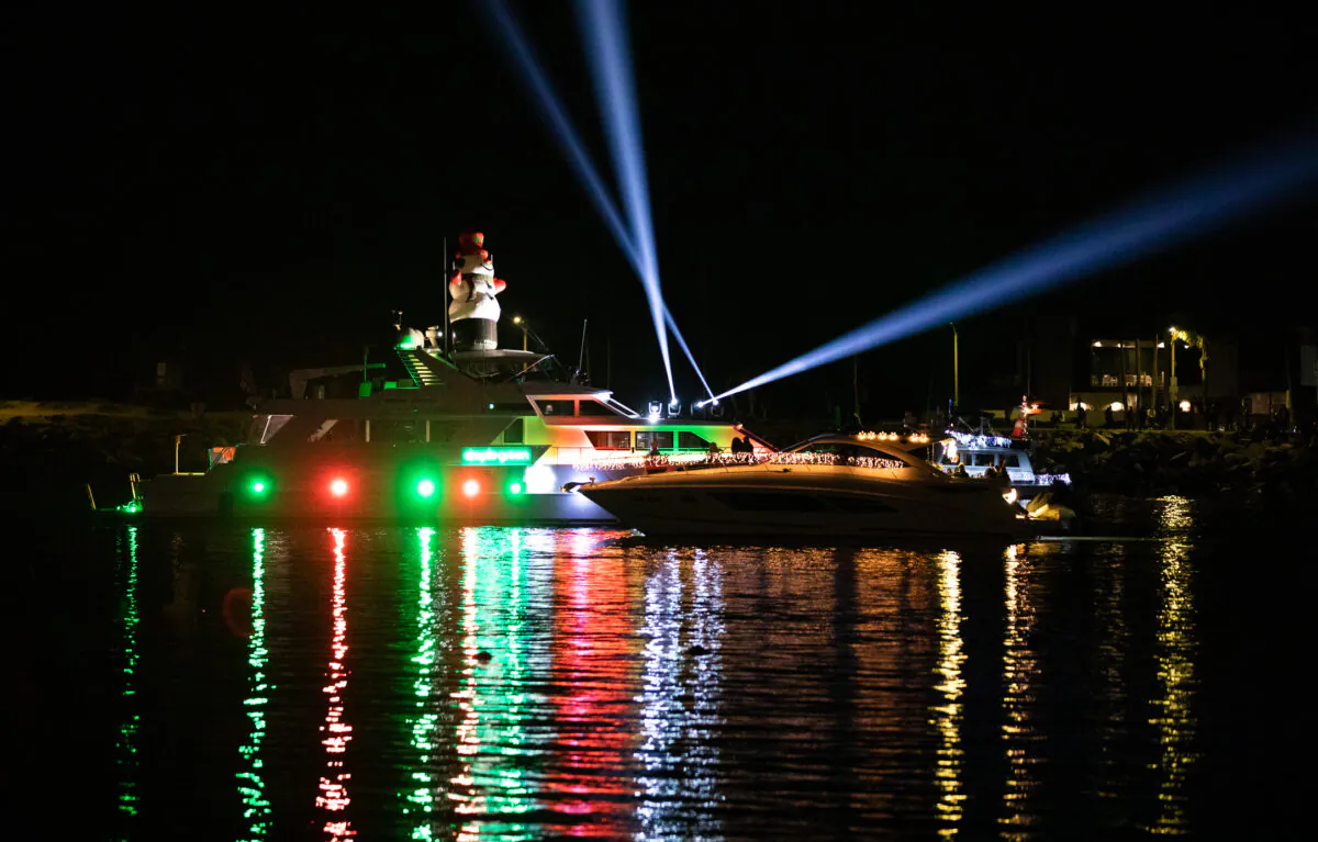 People enjoy the Newport Beach Christmas Boat parade in Newport Beach, Calif., on Dec. 15, 2022. (John Fredricks/The Epoch Times)