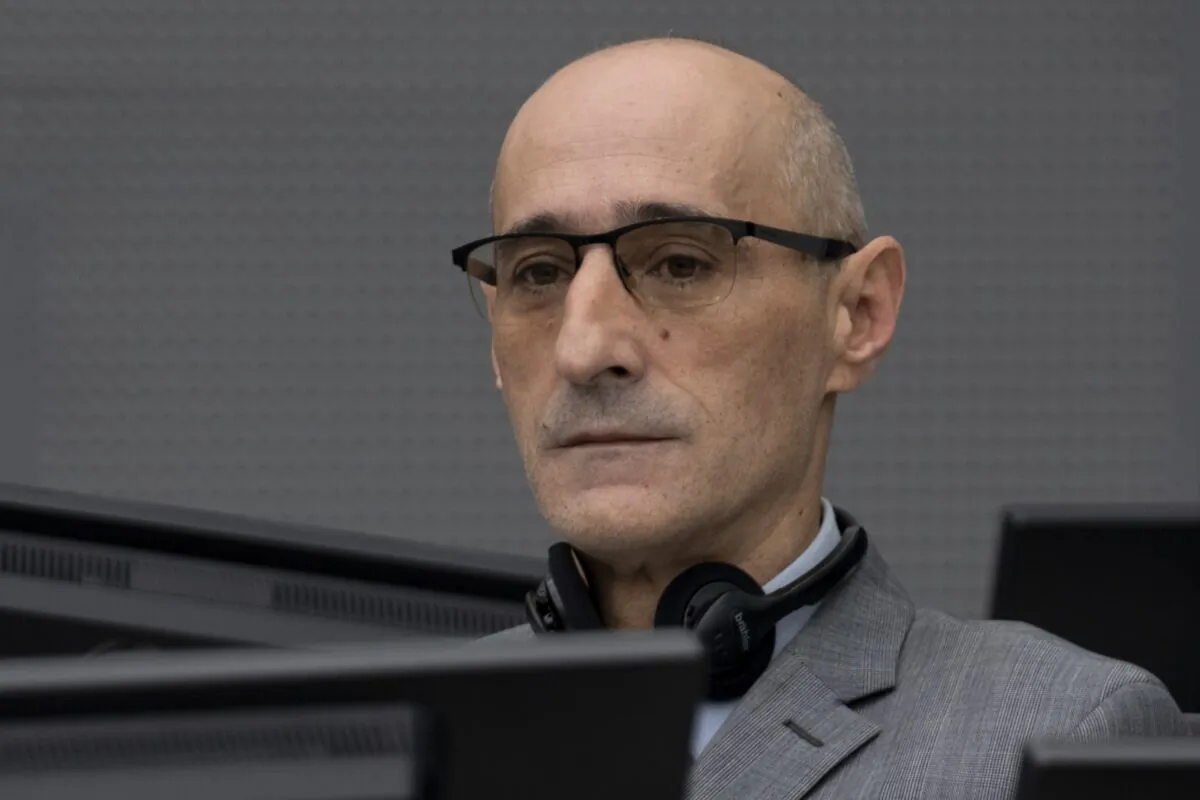 Salih Mustafa, a former Kosovo rebel, waits in the Kosovo Specialist Chambers court for the judges to read the verdict in The Hague, Netherlands, on Dec. 16, 2022. (Peter Dejong/AP Photo)
