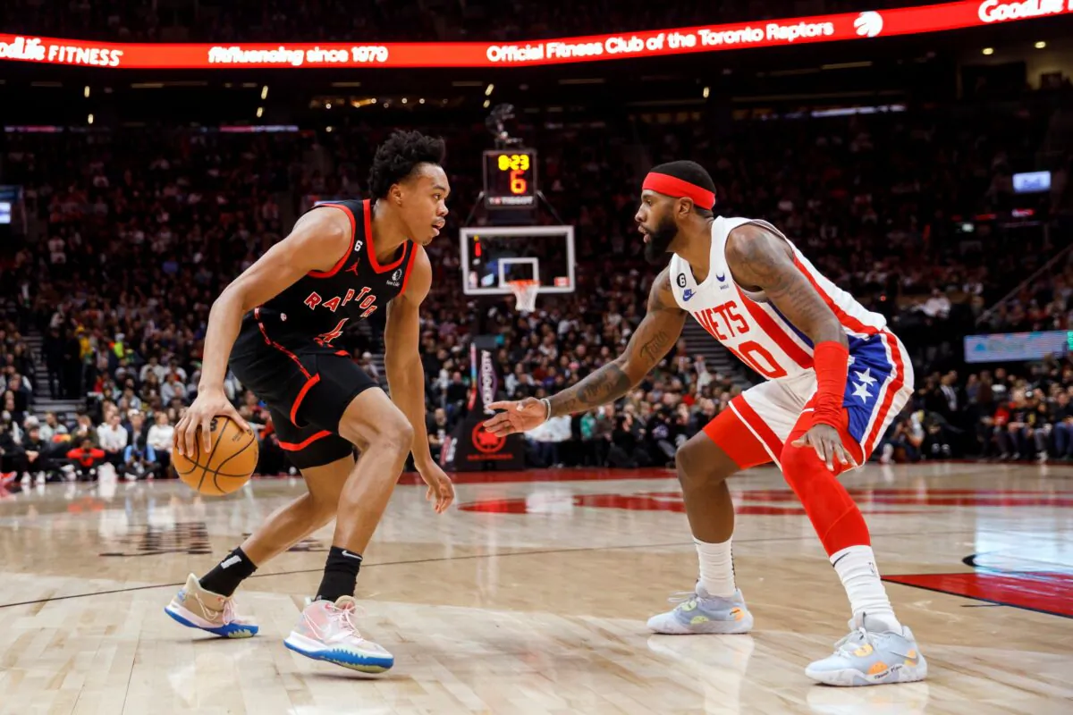 Toronto Raptors forward Scottie Barnes (4) dribbles against Brooklyn Nets forward Royce O'Neale (00) during the first half of an NBA basketball game in Toronto, on Dec. 16, 2022. (Cole Burston/The Canadian Press via AP)