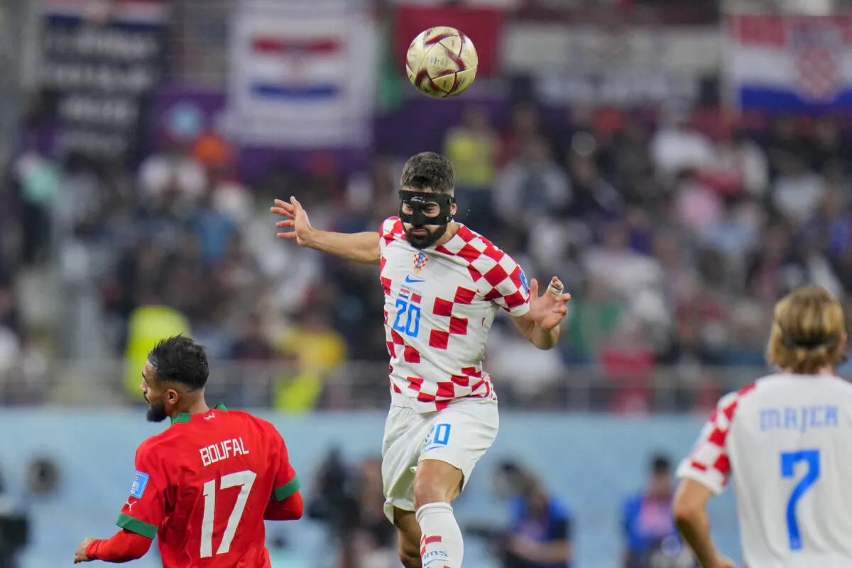 Croatia's Josko Gvardiol heads the ball during the World Cup third-place playoff soccer match between Croatia and Morocco at Khalifa International Stadium in Doha, Qatar, Saturday, Dec. 17, 2022. (AP Photo/Hassan Ammar)