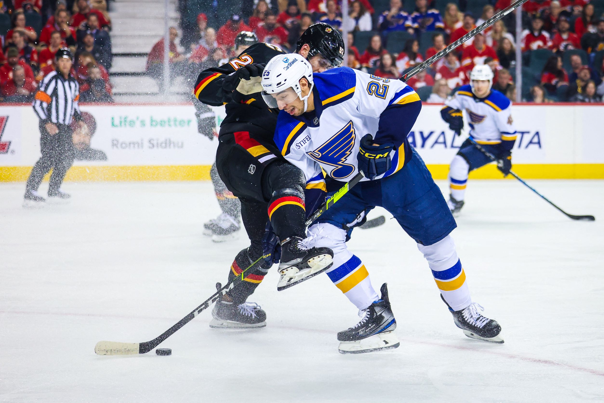 Jordan Kyrou (25), and defenseman MacKenzie Weegar (52)
