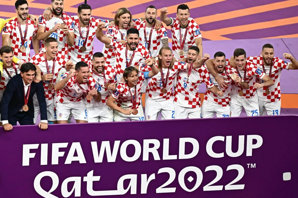 Croatia's players celebrate with medals after winning the Qatar 2022 World Cup football third place play-off match between Croatia and Morocco at Khalifa International Stadium in Doha on Dec. 17, 2022. (Anne-Christine Poujoulat/AFP via Getty Images)