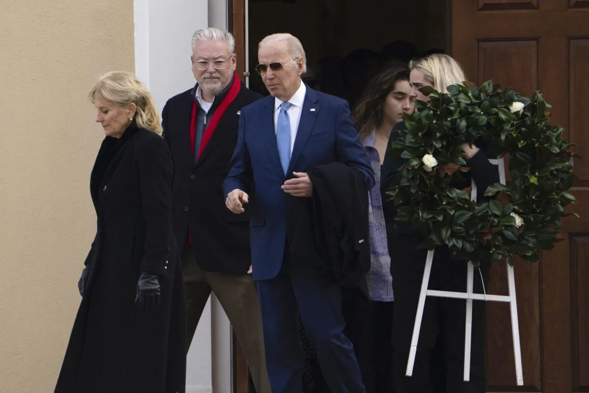 President Joe Biden and First Lady Jill Biden followed by granddaughter Maisy Biden carrying a wreath as they leave St. Joseph on the Brandywine Catholic Church in Wilmington, Del., on Dec. 18, 2022, after attending Mass. (Manuel Balce Ceneta/AP Photo)