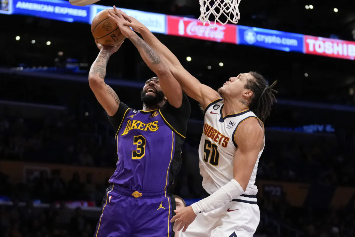 Los Angeles Lakers forward Anthony Davis (3) shoots against Denver Nuggets forward Aaron Gordon (50) during the first half of an NBA basketball game in Los Angeles on Dec. 16, 2022. (Ashley Landis/AP Photo)