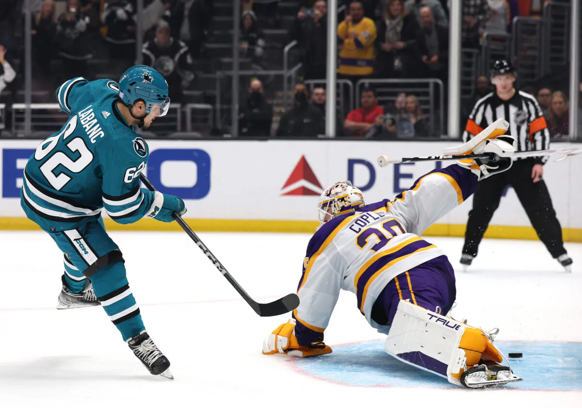 Kevin Labanc (62) of the San Jose Sharks scores on Pheonix Copley (29) of the Los Angeles Kings during a 3–2 overtime shootout Kings win at Crypto.com Arena in Los Angeles on Dec. 17, 2022. (Harry How/Getty Images)