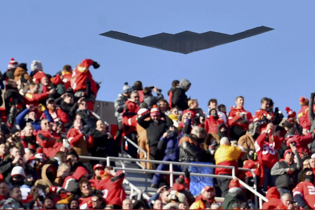 A B-2 bomber flies over spectators at Arrowhead Stadium before an NFL AFC Championship football game between the Kansas City Chiefs and the Tennessee Titans in Kansas City, Mo., on Jan. 19, 2020. (Ed Zurga/AP Photo)
