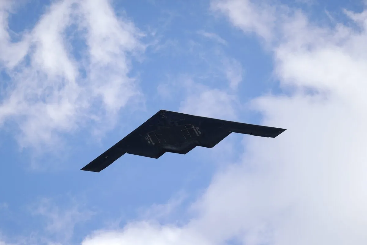 A B-2 Spirit stealth bomber, assigned to the 509th/131st Bomb Wings out of Whiteman Air Force Base, performs a flyover of Barnes-Jewish Hospital to honor healthcare professionals and essential employees fighting against the coronavirus in St. Louis on May 8, 2020. (Jeff Roberson/AP Photo)