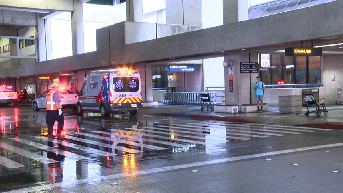 The scene outside the international airport in Honolulu after nearly a dozen people were seriously injured when a flight to Hawaii hit severe turbulence on Dec. 18, 2022. (Hawaii News Now via AP)