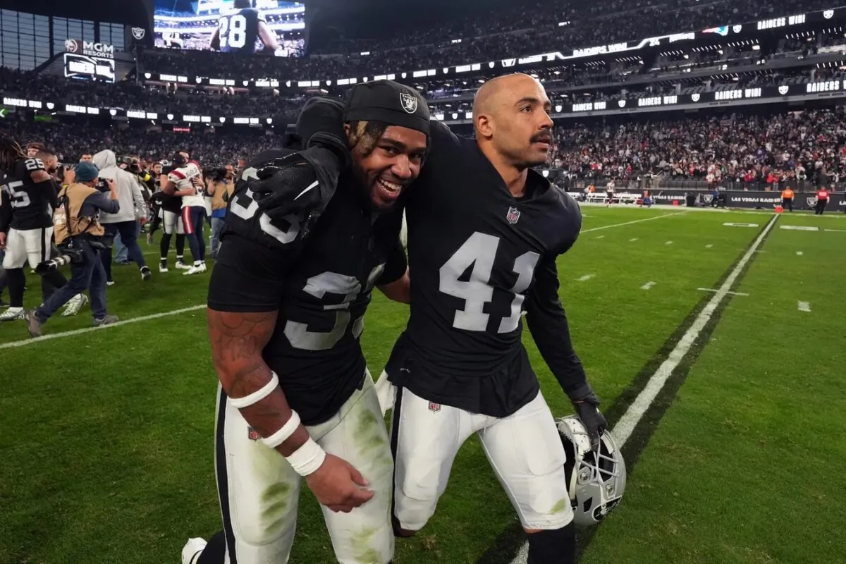 Las Vegas Raiders running back Zamir White (35) and safety Matthias Farley (41) celebrate after the game against the New England Patriots at Allegiant Stadium in Paradise, Nev., on Dec. 18, 2022. (Kirby Lee/USA TODAY Sports via Field Level Media)