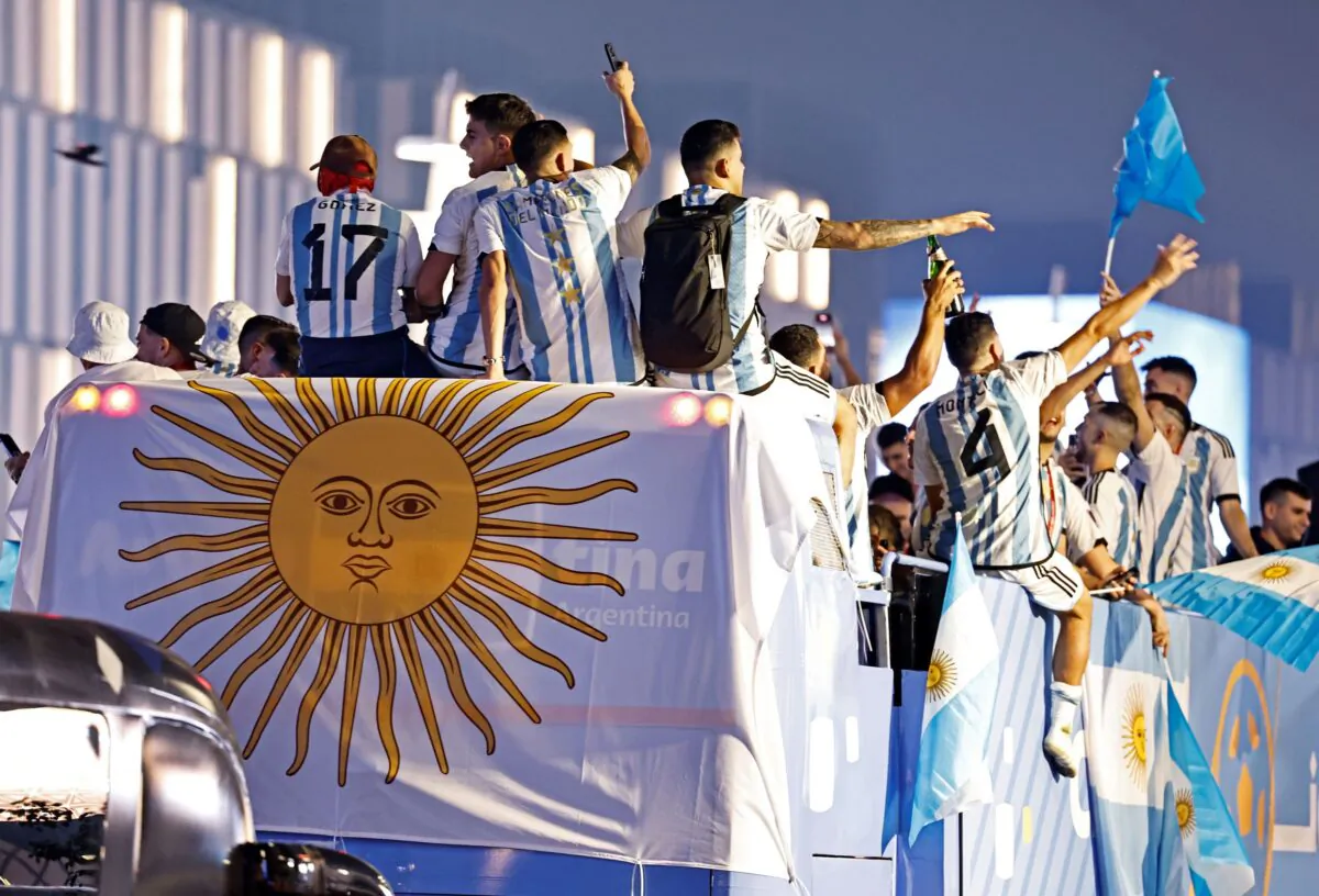 Argentina players celebrate on a bus outside the stadium after winning the World Cup during the FIFA World Cup Qatar 2022, the Final match between Argentina and France, at Lusail Stadium, Lusail, Qatar, on Dec. 19, 2022. (Hamad I Mohammed/Reuters)