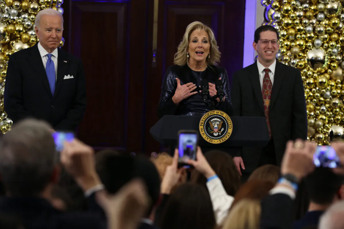 First Lady Jill Biden speaks as President Joe Biden and Rabbi Charlie Cytron-Walker look on during a Hanukkah holiday reception in the Grand Foyer of the White House in Washington on Dec. 19, 2022. (Alex Wong/Getty Images)