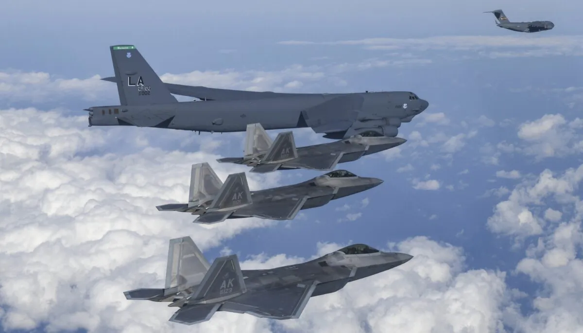 A U.S. B-52 bomber, C-17, and South Korean Air Force F-35 fighter jets fly over the Korean Peninsula during a joint air drill in South Korea on Dec. 20, 2022. (South Korean Defense Ministry via AP)
