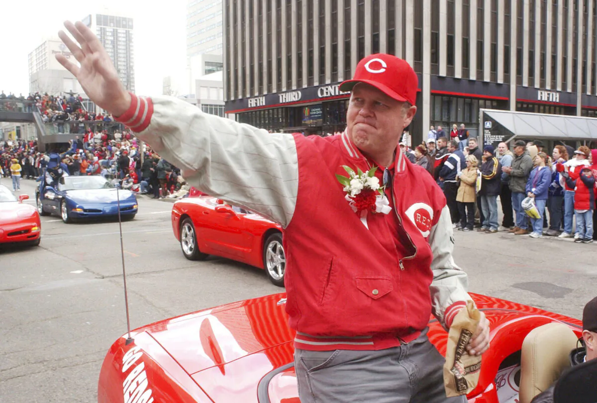 Former Cincinnati Reds pitcher Tom Browning waves during the Findlay Market Parade through downtown Cincinnati on March 31, 2003. (Tom Uhlman/AP Photo)