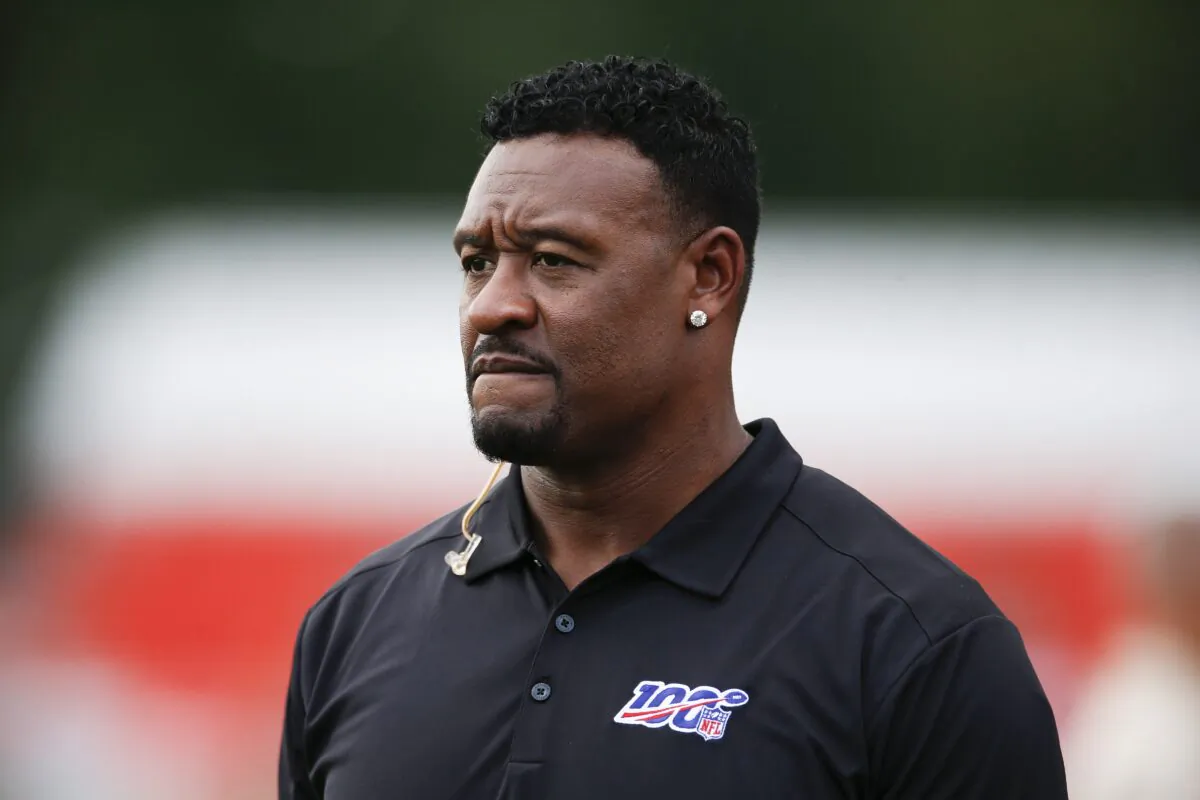 Former NFL football player Willie McGinest Jr. watches the Cleveland Browns during practice at the team's training facility in Berea, Ohio, on July 31, 2019. (Ron Schwane/AP Photo)