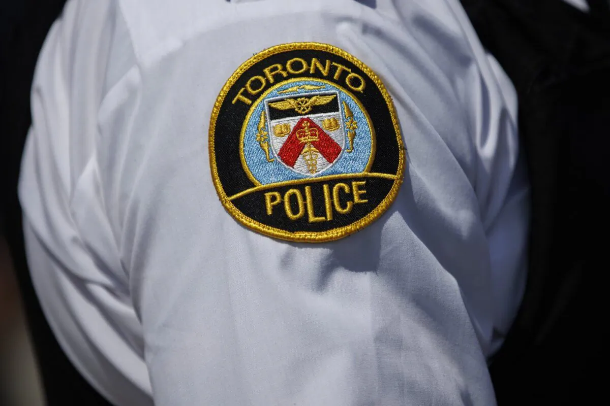 A Toronto Police logo is shown during a press conference in Toronto on Aug. 5, 2022. (Cole Burston/The Canadian Press)
