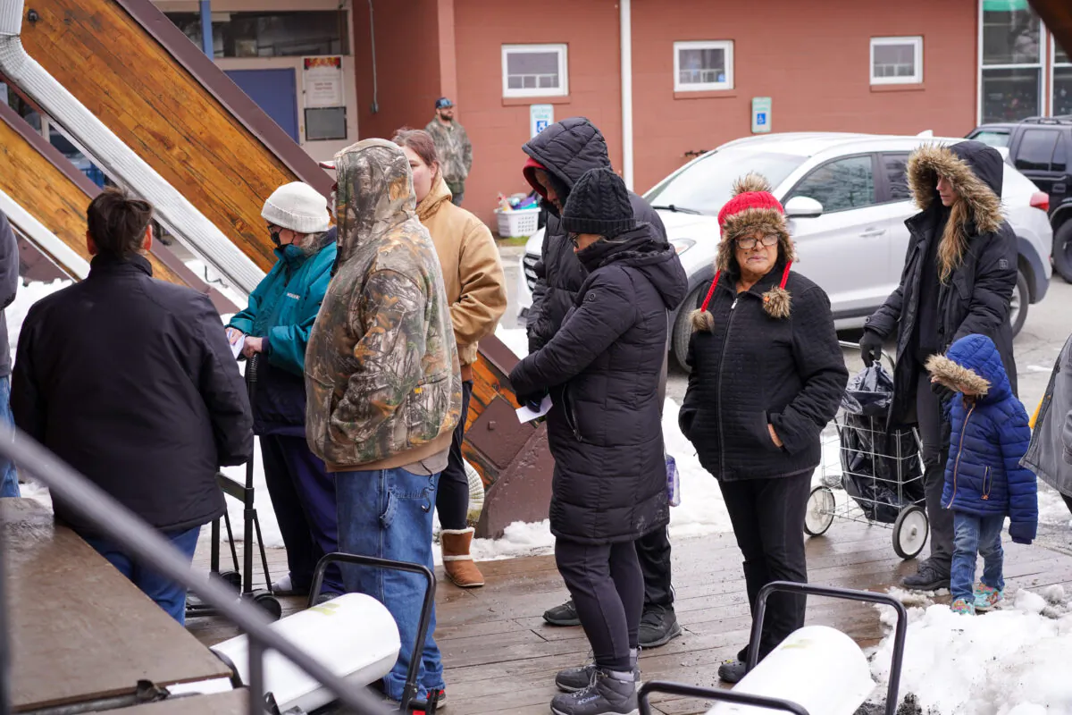 Local residents line up to get food from the Easterseals Project Discovery food pantry in Port Jervis, N.Y., on Dec. 19, 2022. (Cara Ding/The Epoch Times)