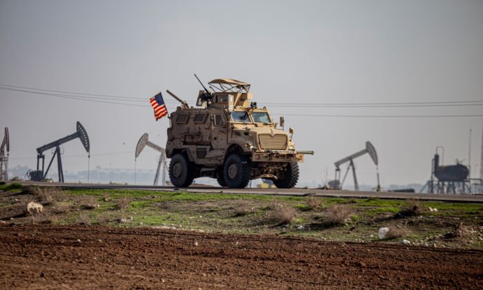 A US military vehicle on a patrol in the countryside near the town of Qamishli, Syria, on Dec. 4, 2022. (Baderkhan Ahmad/AP Photo)