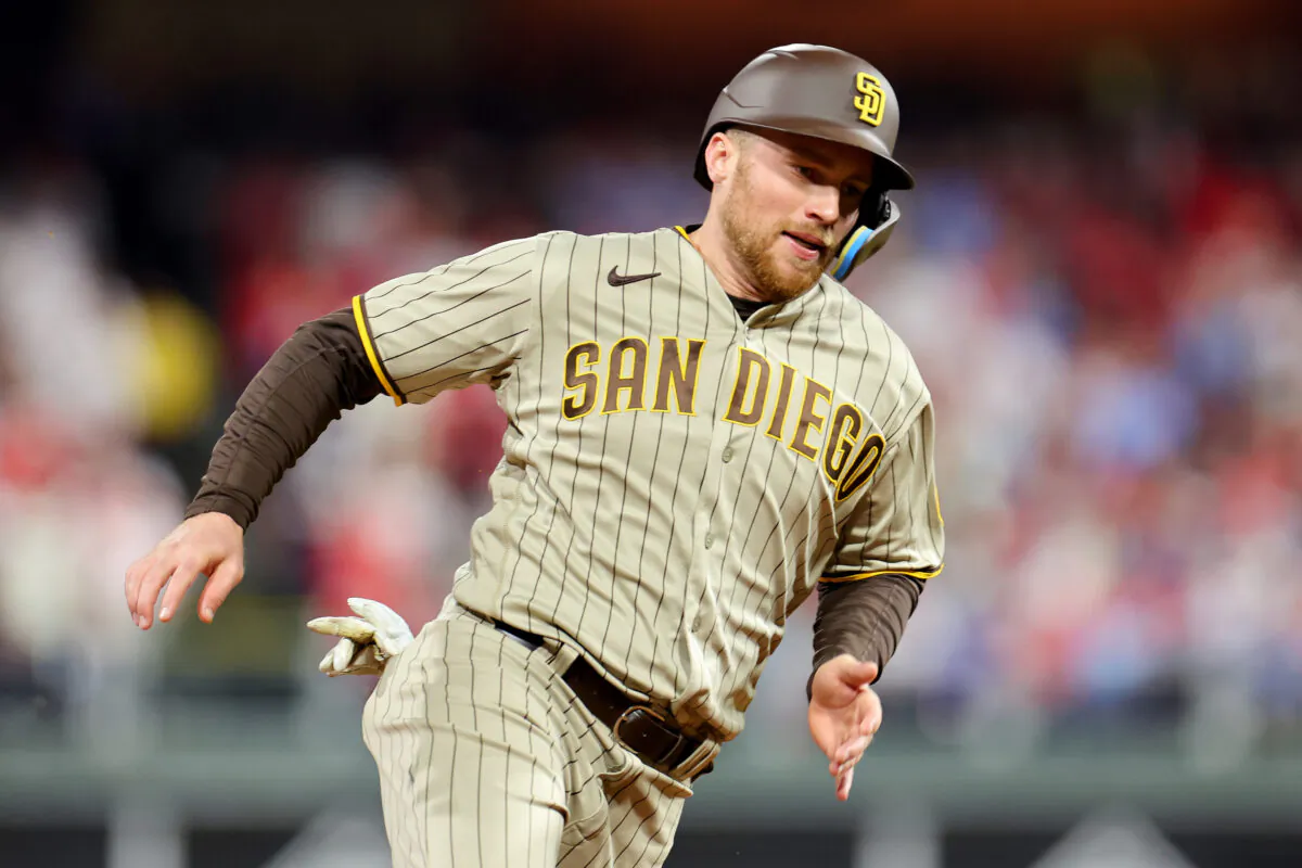 Brandon Drury (17) of the San Diego Padres scores a run during the first inning against the Philadelphia Phillies in game four of the National League Championship Series at Citizens Bank Park in Philadelphia on Oct. 22, 2022. (Michael Reaves/Getty Images)