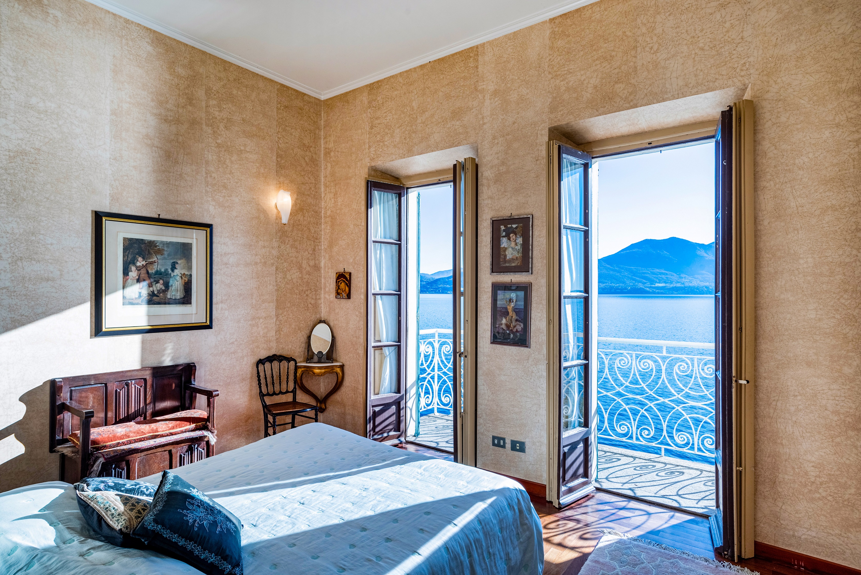 Image 8 The villa_s bedrooms open large windows to take in Lake Maggiore_s picturesque beauty. (Courtesy of Sotheby_s International Realty)