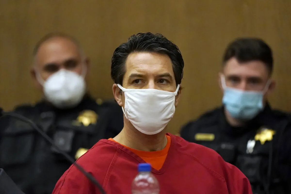 Scott Peterson listens during a hearing to determine whether he gets a new trial for the 2002 murder of his pregnant wife, Laci Peterson, and unborn son because of juror misconduct at the San Mateo County Superior Court in Redwood City, Calif., on Feb. 25, 2022. (Jeff Chiu/AP Photo, Pool)