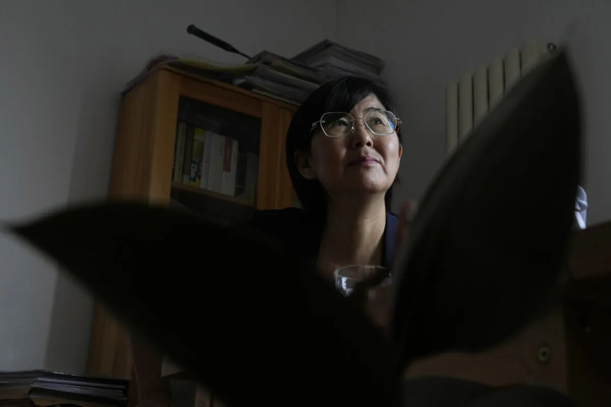 Activist Wang Yu, who found that her COVID-19 health app changed color and prevented her from traveling in Beijing, speaks during an interview on June 30, 2022. (Ng Han Guan/AP Photo)