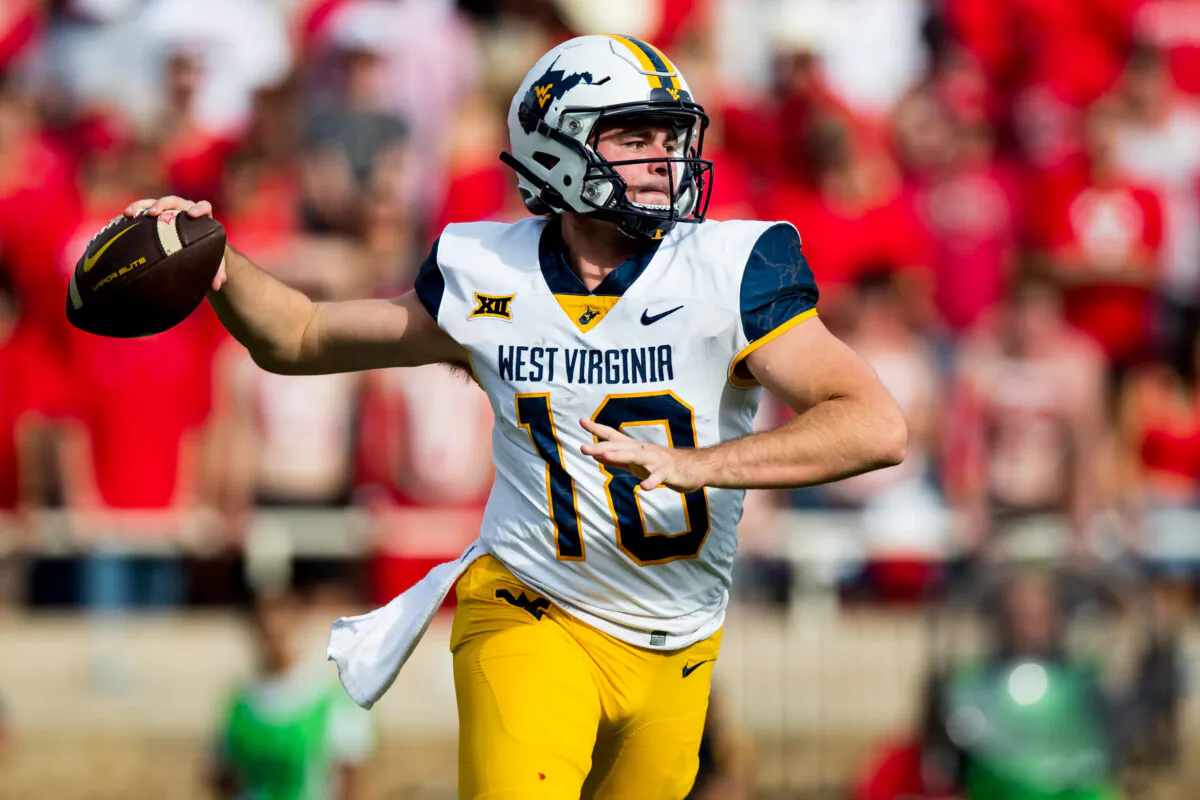 Quarterback JT Daniels (18) of the West Virginia Mountaineers passes the ball during the second half of the game against the Texas Tech Red Raiders at Jones AT&T Stadium in Lubbock, Texas, on Oct. 22, 2022. (John E. Moore III/Getty Images)