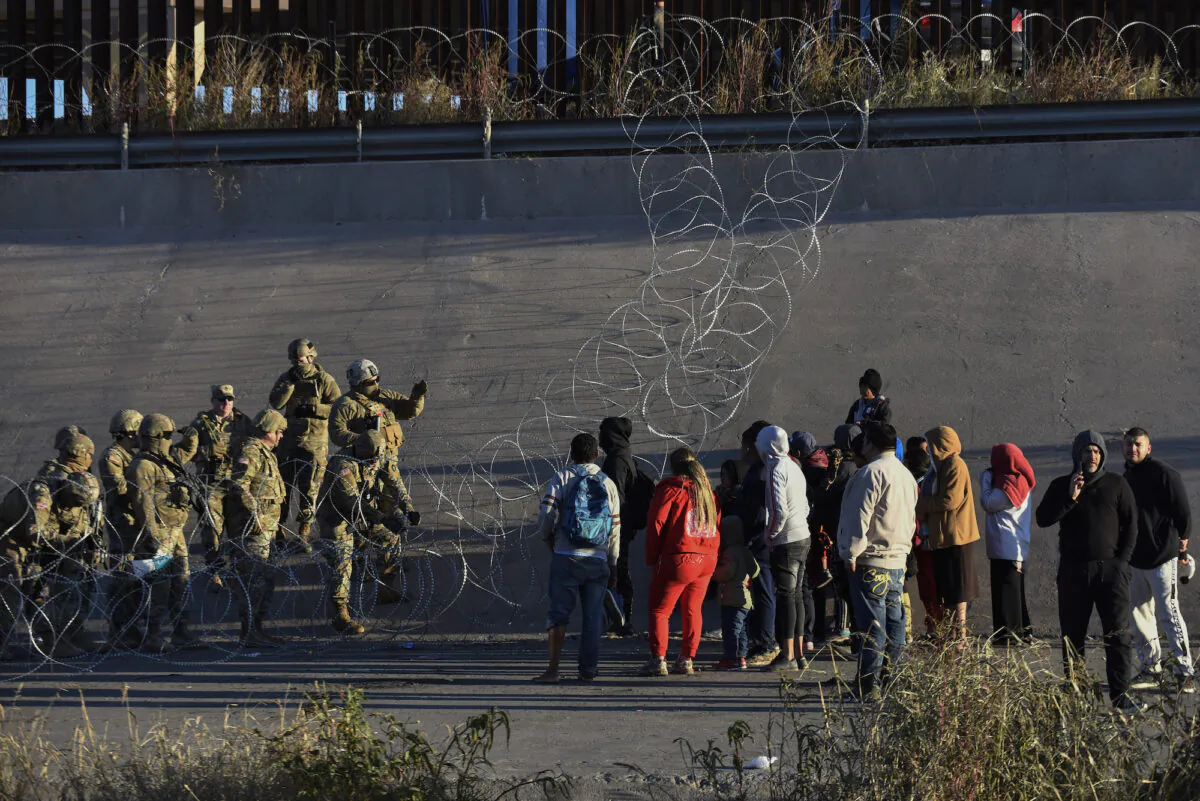 The U.S. military stops people from crossing into El Paso, Texas, as seen from Ciudad Juarez, Mexico, on Dec. 20, 2022. (Christian Chavez/AP Photo)