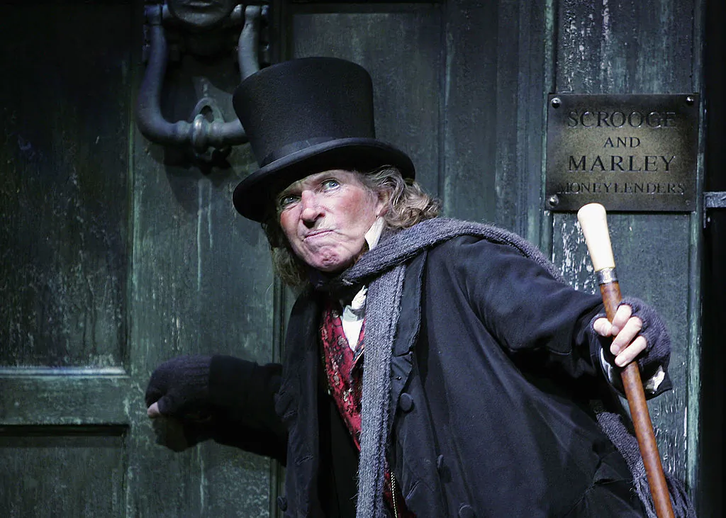 Actor Tommy Steele in his role as Ebenezer Scrooge at the London Palladium in London, on Oct. 27, 2005. We might all aspire to become more Scroogelike, not the misanthrope, but the reborn Ebenezer, who came to value laughter, generosity, and affection. (MJ Kim/Getty Images)