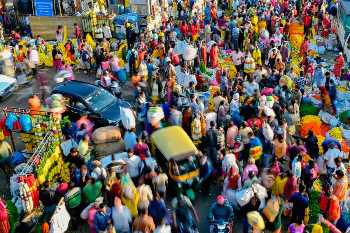 People walk through a market in Bangalore, India, on Nov. 15, 2022. (Manjunath Kiran/AFP via Getty Images)
