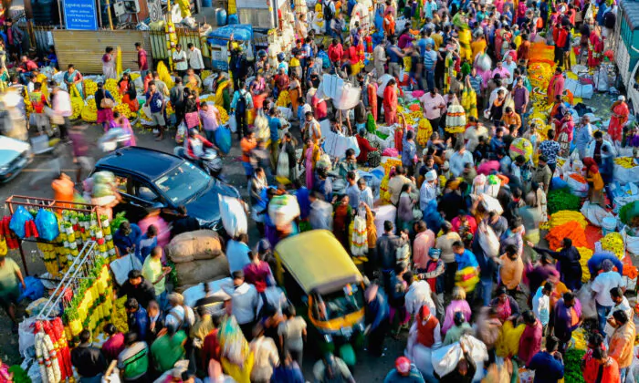 People walk through a market in Bangalore, India, on Nov. 15, 2022. (Manjunath Kiran/AFP via Getty Images)