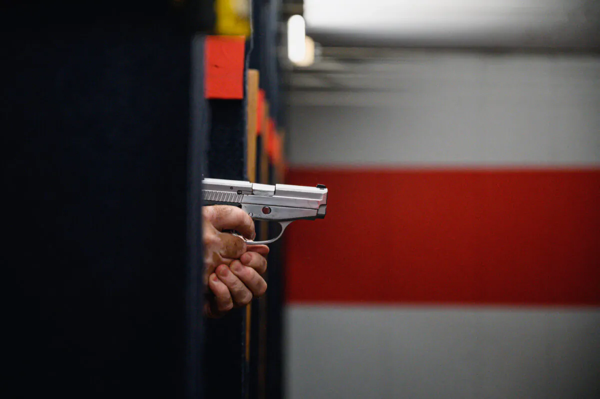 Shooting range owner John Deloca aims his pistol on his range in Queens, N.Y., on June 23, 2022. (Ed Jones/AFP via Getty Images)