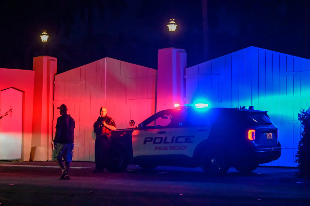 A police car sits outside former President Donald Trump's residence at Mar-A-Lago, in Palm Beach, Fla., on Aug. 8, 2022, as the FBI searches his home for classified documents. (GIORGIO VIERA/AFP via Getty Images)