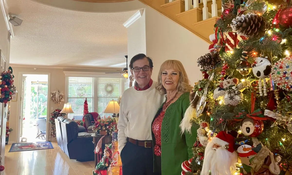 Sylvia Nash and Loren Lillestrand showcase their elaborately decorated home with 85 Christmas trees, thousands of twinkling lights, 300 Santa Clauses, among other elements in Chino Hills, Calif., on Dec. 16, 2022. (Carol Cassis/The Epoch Times)