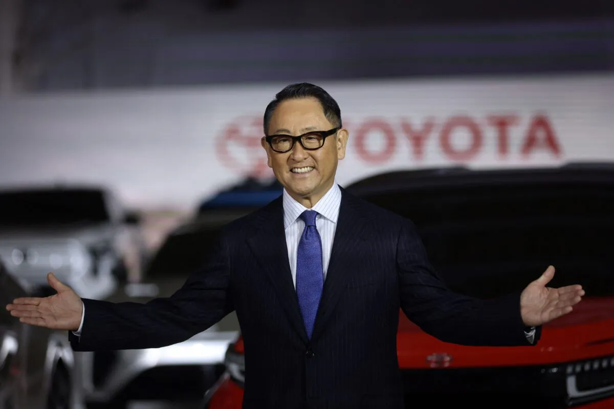 Toyota President Akio Toyoda gestures at a briefing on electric vehicle battery strategies at the company's showroom in Tokyo, on Dec. 14, 2021. (Behrouz Mehri/AFP via Getty Images)