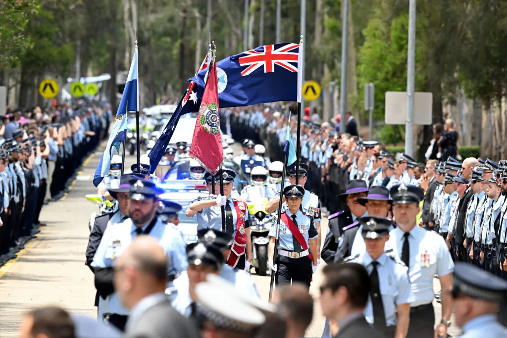 A guard of honour is seen as police officers pay their respects in Brisbane, Australia on Dec. 21, 2022. (Bradley Kanaris/Getty Images)