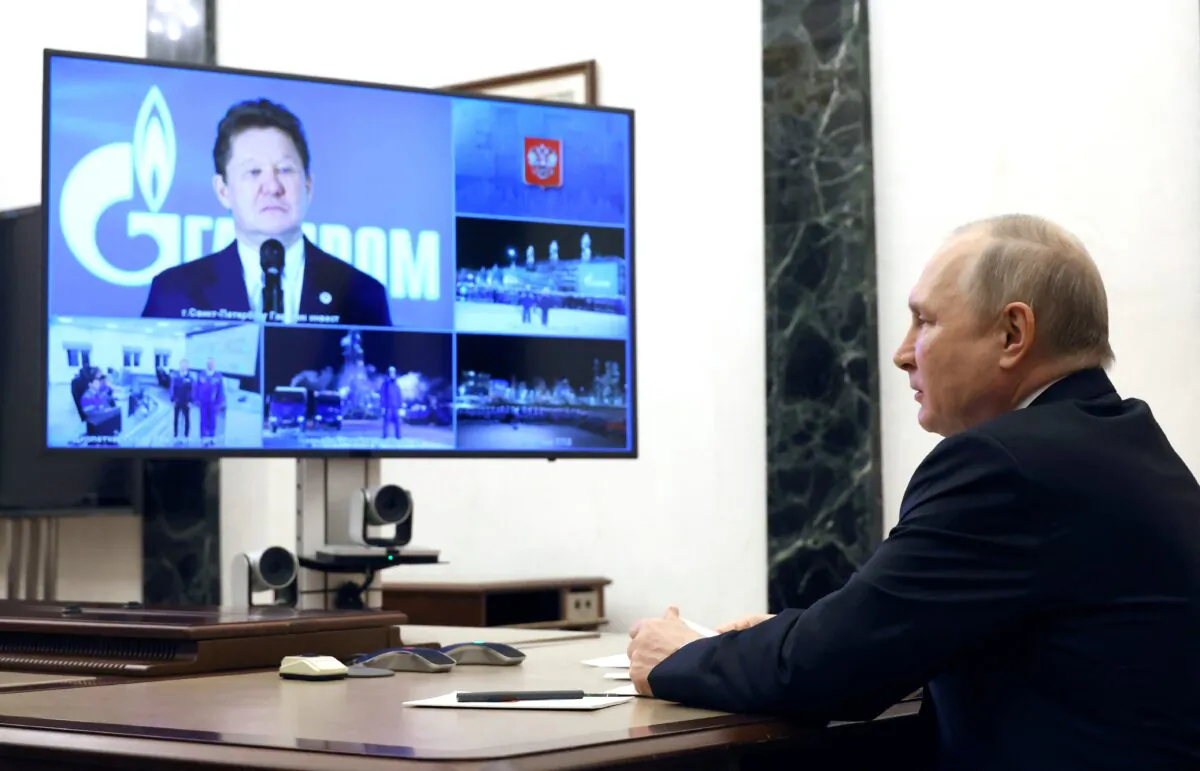 Russian President Vladimir Putin takes part in a ceremony launching production at the Kovykta gas field, which will feed into the Power of Siberia pipeline carrying Russian gas to China, via a video link with head of Gazprom Alexei Miller in Moscow on Dec. 21, 2022. (Sputnik/Mikhail Kuravlev/Kremlin via Reuters)