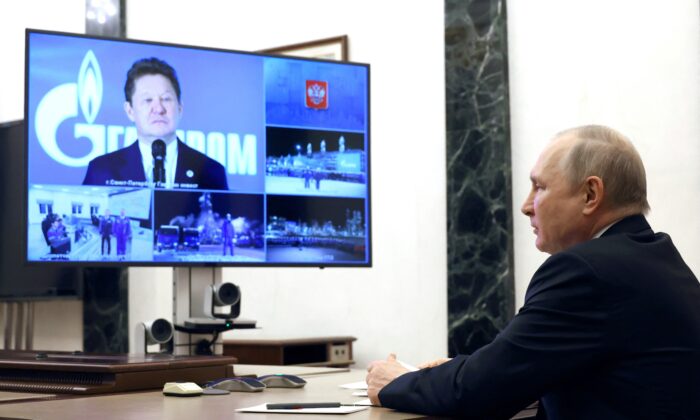 Russian President Vladimir Putin takes part in a ceremony launching production at the Kovykta gas field, which will feed into the Power of Siberia pipeline carrying Russian gas to China, via a video link with head of Gazprom Alexei Miller in Moscow on Dec. 21, 2022. (Sputnik/Mikhail Kuravlev/Kremlin via Reuters)