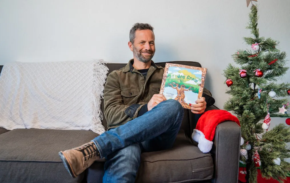 Kirk Cameron with his new children's book, "As You Grow." (Courtesy of Brave Books/Erin Kukowski)