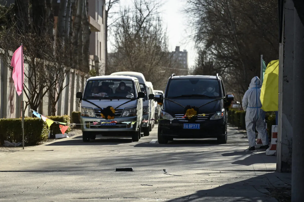 Hearses are seen waiting to enter a crematorium in Beijing, China, amid a mass wave of COVID-19 infections on Dec. 22, 2022. (STF/AFP via Getty Images)