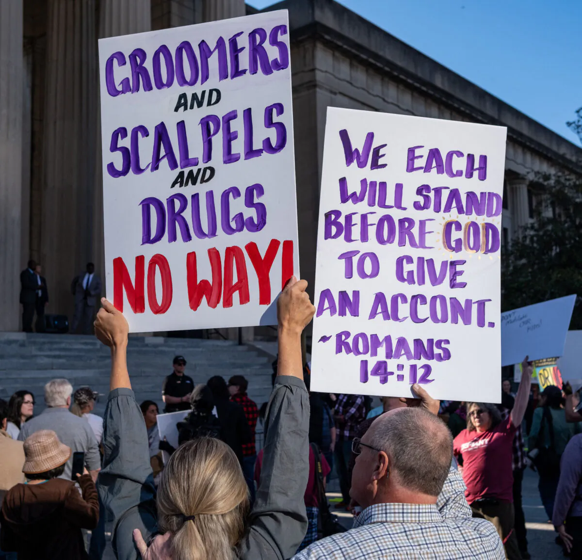 Protesters hold placards during a rally against gender-affirming care at the War Memorial Plaza in Nashville, Tenn., on Oct. 21, 2022. (Seth Herald/AFP via Getty Images)