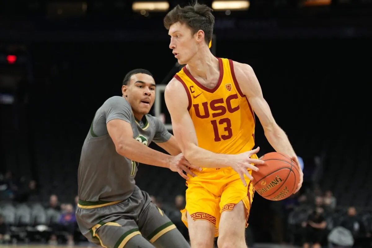 USC Trojans guard Drew Peterson (13) dribbles against Colorado State Rams guard John Tonje (1) during the first half at Footprint Center in Phoenix on Dec. 21, 2022. (Joe Camporeale/USA TODAY Sports via Field Level Media)