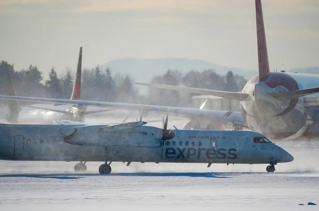 An Air Canada aircraft taxis at Vancouver International Airport in Richmond, B.C., on Dec. 21, 2022. (Darryl Dyck/The Canadian Press)